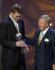 New England Patriots quarterback Tom Brady accepts the Espy award for best breakthrough athlete from Patriots owner Robert Kraft during the 10th annual Espy Awards, Wednesday, July 10, 2002, in Los Angeles. The Espy Awards recognize the top achievements and perfomers in sports. (AP Photo/Mark J. Terrill) 