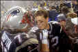 Tom Brady and Mike Compton celebrate their win over the Oakland Raiders.