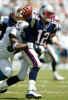 Miami Dolphins right end Jason Taylor (99) sacks New England Patriots quarterback Tom Brady (12) in the first half of play at Pro Player Stadium in Miami, Florida October 6, 2002. REUTERS/ Marc Serota 