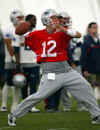 New England Patriots quarterback Tom Brady looks down field during passing drills at the Patriots minicamp practice in Foxboro, Mass. on Friday, June 7, 2002. (AP Photo/Joe Giblin) 