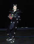 New England Patriots' quarterback Tom Brady, the MVP of this year's Super Bowl, wears a black suit with reflective balls drops back to pass while rehearsing his moves during a animation image capturing session for a new video football game featuring his likeness Tuesday May 7, 2002 in San Diego. (AP Photo/Lenny Ignelzi) 