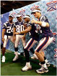 From left, Ty Law, Brown, Lawyer Milloy, and Brady strike a pose for photographers. All four sported bright new Super Bowl XXXVI visors. (Globe Staff Photo / John Bohn) 