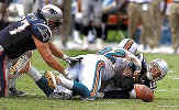 Tom gets sacked during the Miami Dolphins game.