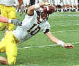 Tom Brady reaches to the end zone for a fourth-quarter touchdown. Brady passed for the game-winning TD minutes later.(AP)