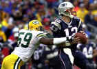 New England Patriots quarterback Tom Brady, right, gets pressured by Green Bay Packers line backer Na'il Diggs (59) during the first half in Foxboro, Mass., Sunday Oct. 13, 2002. (AP Photo/Charles Krupa) 