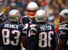 New England Patriots quarterback Tom Brady talks with wide receivers Dion Branch (83), David Patten (86) and Troy Brown, right, during the first half in their game against the Green Bay Packers in Foxboro, Mass., Sunday Oct. 13, 2002. The Patriots failed to energize their offense for the third straight week, falling to the Packers 28-10. (AP Photo/Stephan Savoia) 