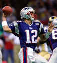 Tom gets ready to pass the ball in the regular season game against the St. Louis Rams.