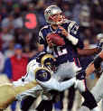 Tom takes a sack against the St. Louis Rams