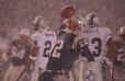 Tom spikes the ball after his first NFL touchdown during the Raiders game.  He immediately fell on his face in the snow.