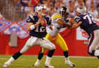 New England Patriots quarterback Tom Brady (12) sets up to pass as Patriots tackle Matt Light (72) keeps Pittsburg Steelers linebacker Clark Haggans (53) at bay during second quarter action of their AFC conference game in Foxboro, Mass., Monday night Sept 9, 2002. (AP Photo/Stephan Savoia) 