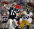 New England Patriots quarterback Tom Brady pulls back to pass as he eludes Pittsburgh Steelers linebacker Joey Porter during the third quarter in Foxboro, Mass., Monday night, Sept. 9, 2002. (AP Photo/Winslow Townson) 