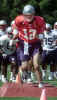 New England Patriots quarterback Tom Brady runs through drills during training camp Tuesday, July 30, 2002, at Bryant College in Smithfield, R.I. (AP Photo/Stew Milne) 