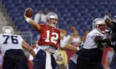 New England Patriots quarterback Tom Brady (12) throws a pass at the newly named Gillette Stadium in Foxboro, Mass. Monday, Aug. 5, 2002, as the team practices for the first time in the new stadium. (AP Photo/Elise Amendola) 