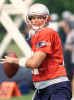 New England Patriots quarterback Tom Brady looks for an open receiver during drills at training camp Monday, Aug. 12, 2002, in Smithfield, R.I. (AP Photo/Victoria Arocho) 